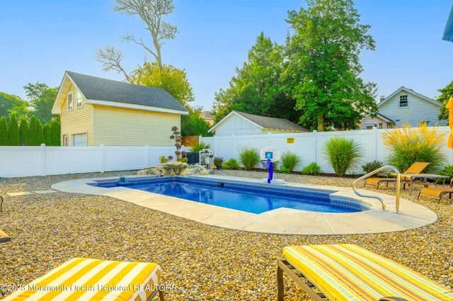 a view of a swimming pool with a patio