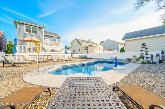 an aerial view of residential building and ocean