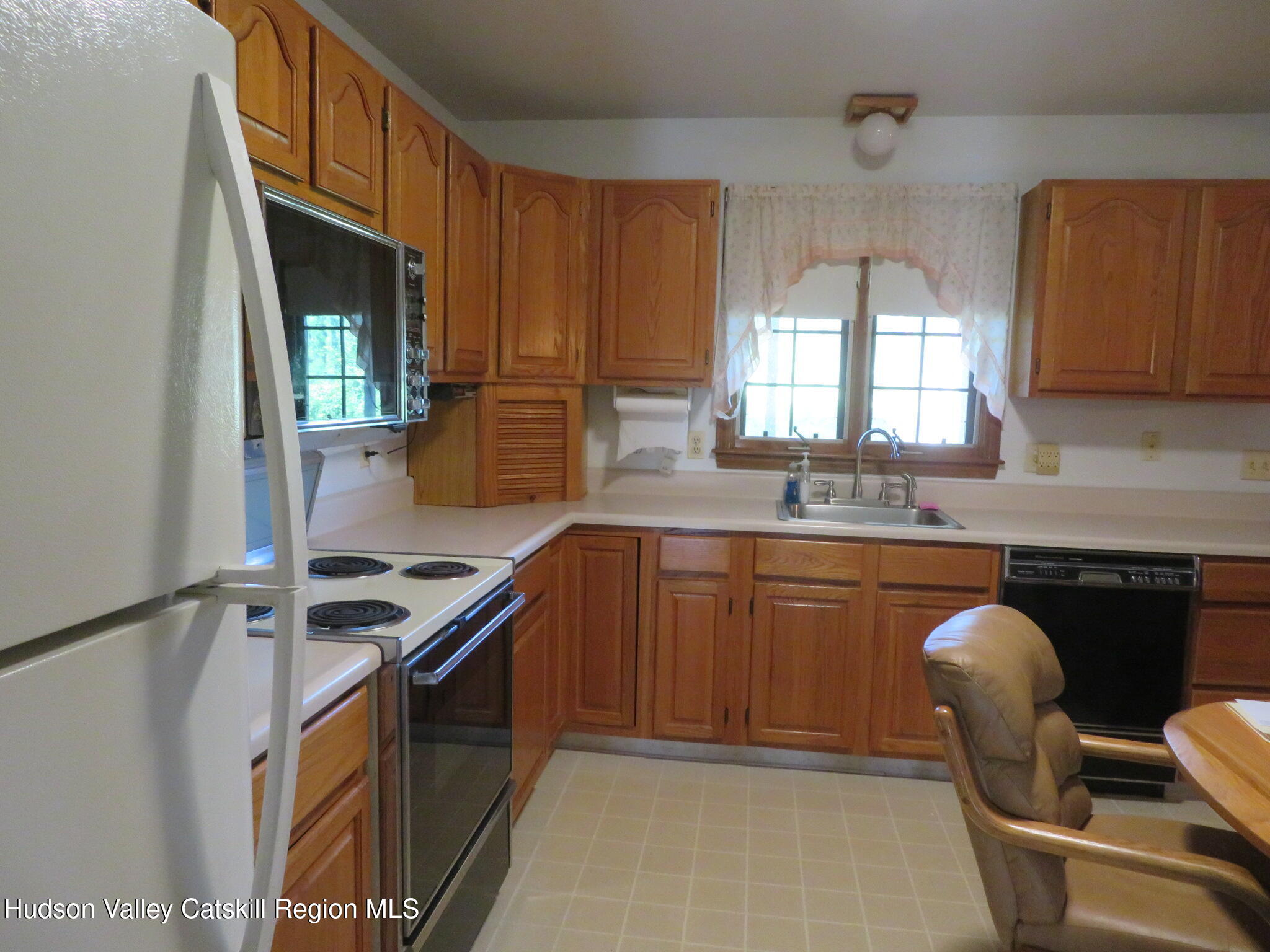 89 Vincent Lane Stone Ridge, NY 12484 - Photo 15 of 45 a kitchen with stainless steel appliances granite countertop a stove a sink and a microwave