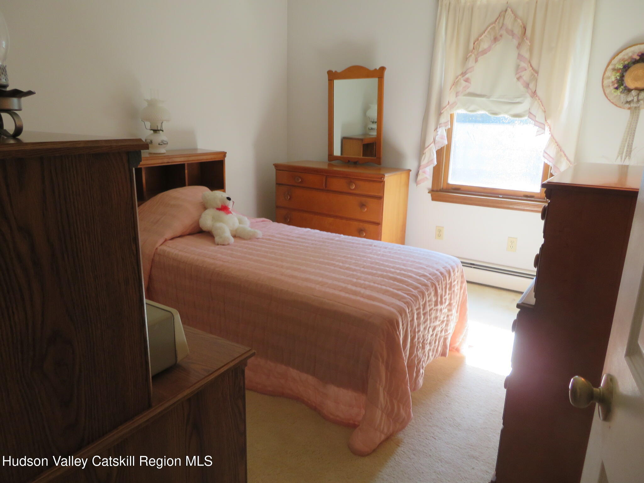 89 Vincent Lane Stone Ridge, NY 12484 - Photo 21 of 45 a bedroom with a bed and wooden floor