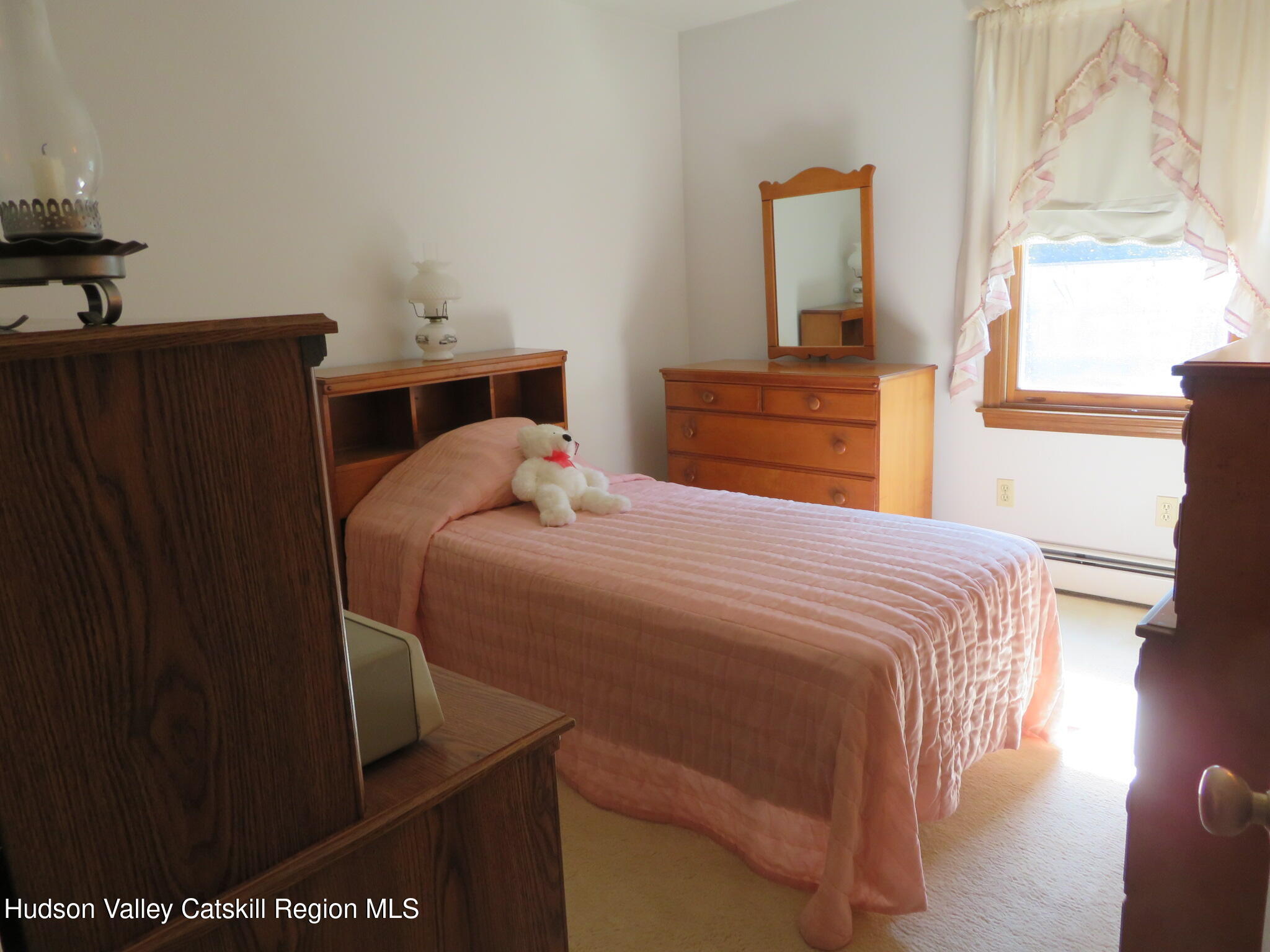 89 Vincent Lane Stone Ridge, NY 12484 - Photo 23 of 45 a bedroom with a bed and a window