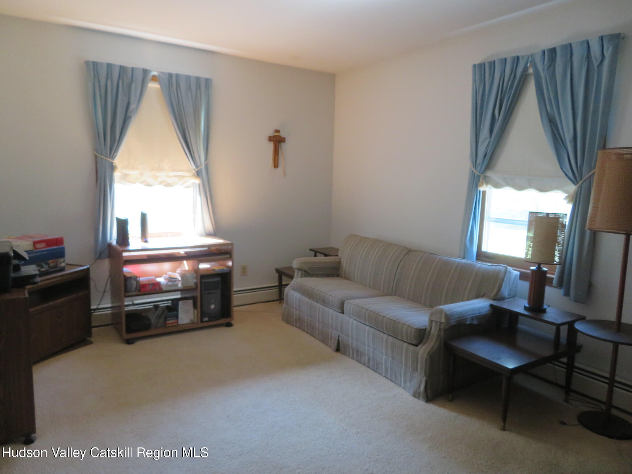 89 Vincent Lane Stone Ridge, NY 12484 - Photo 24 of 45 a living room with furniture a flat screen tv and a window