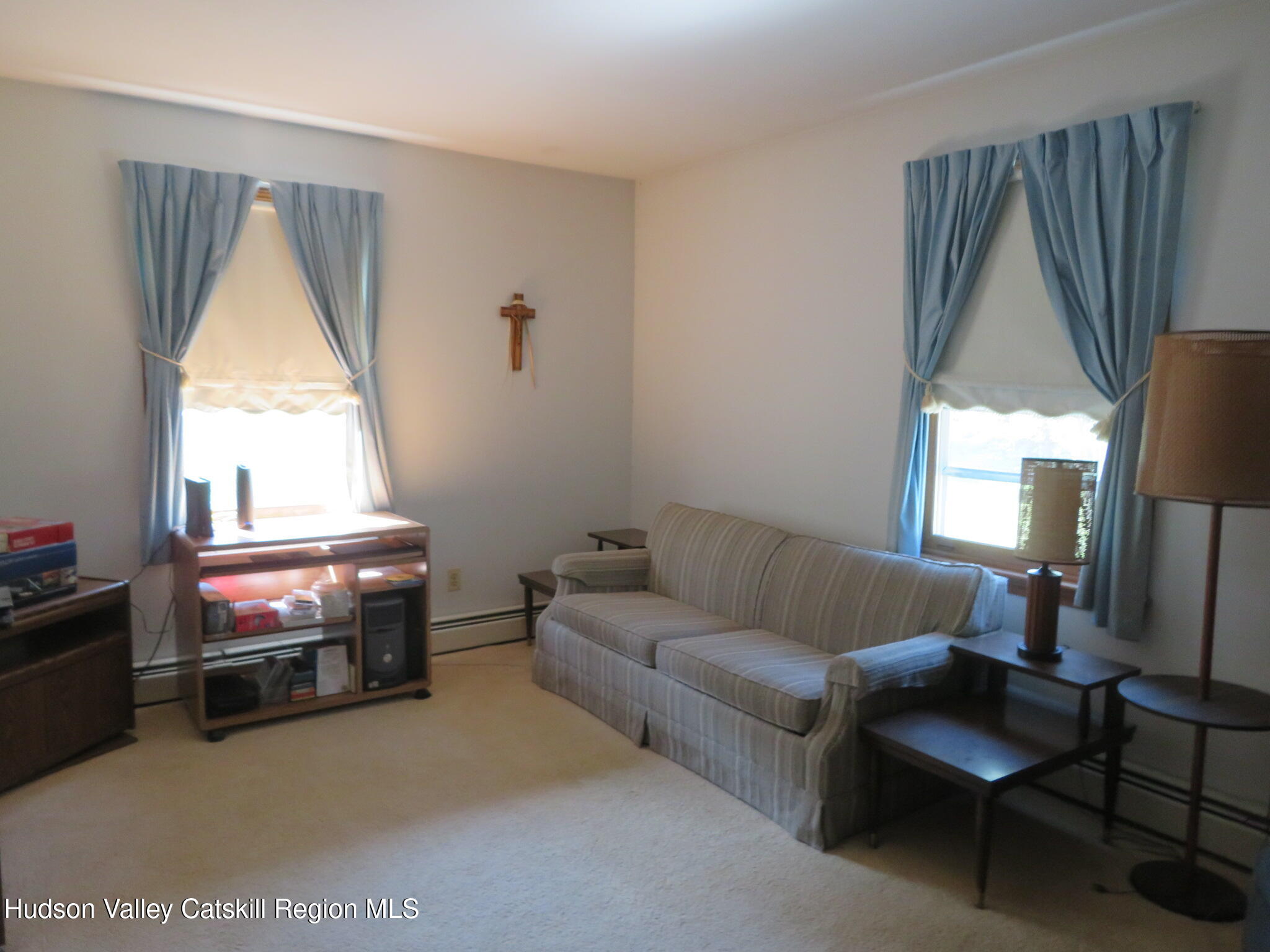 89 Vincent Lane Stone Ridge, NY 12484 - Photo 27 of 45 a living room with furniture and a window