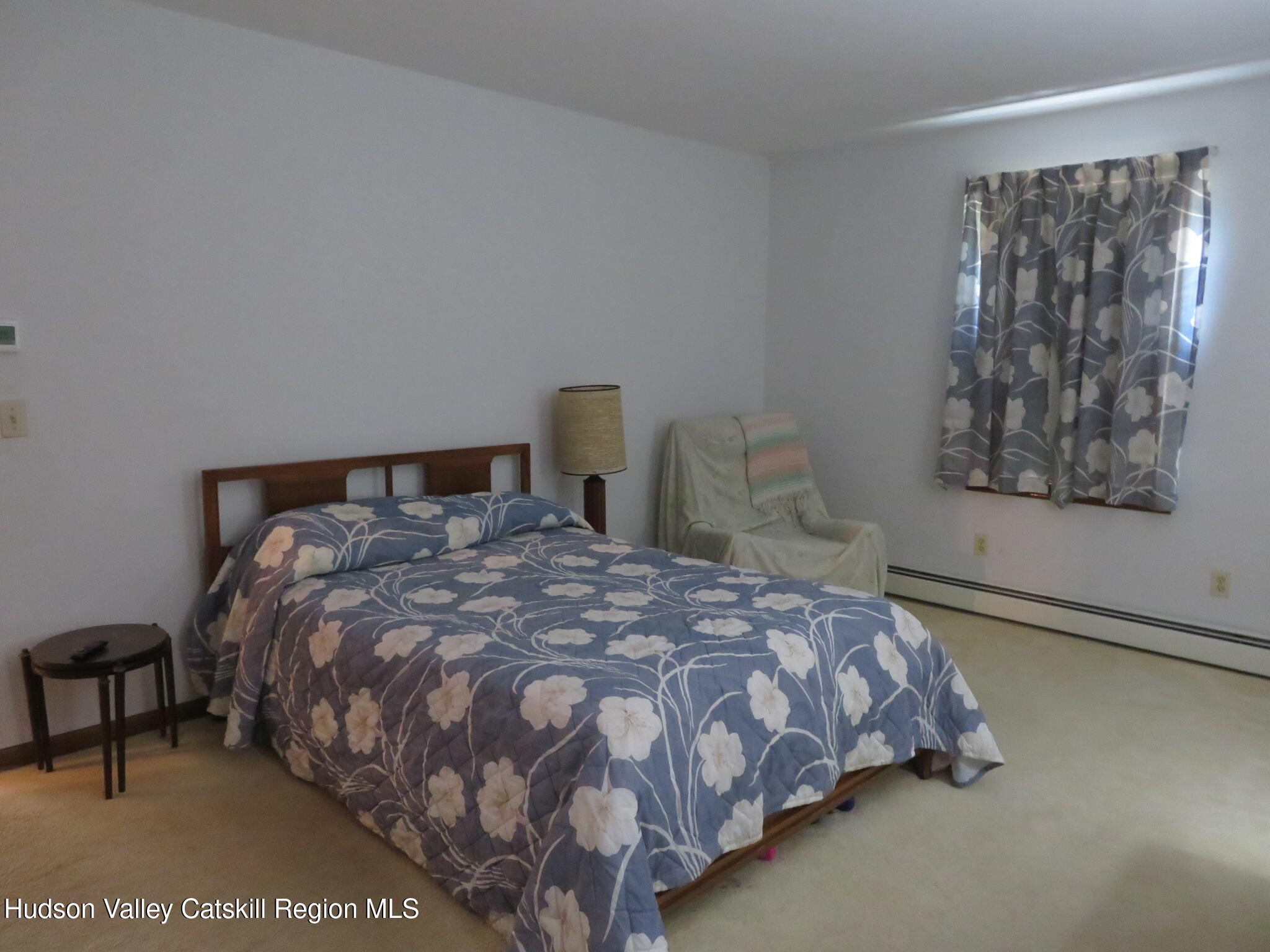 89 Vincent Lane Stone Ridge, NY 12484 - Photo 28 of 45 a bedroom with a bed and window