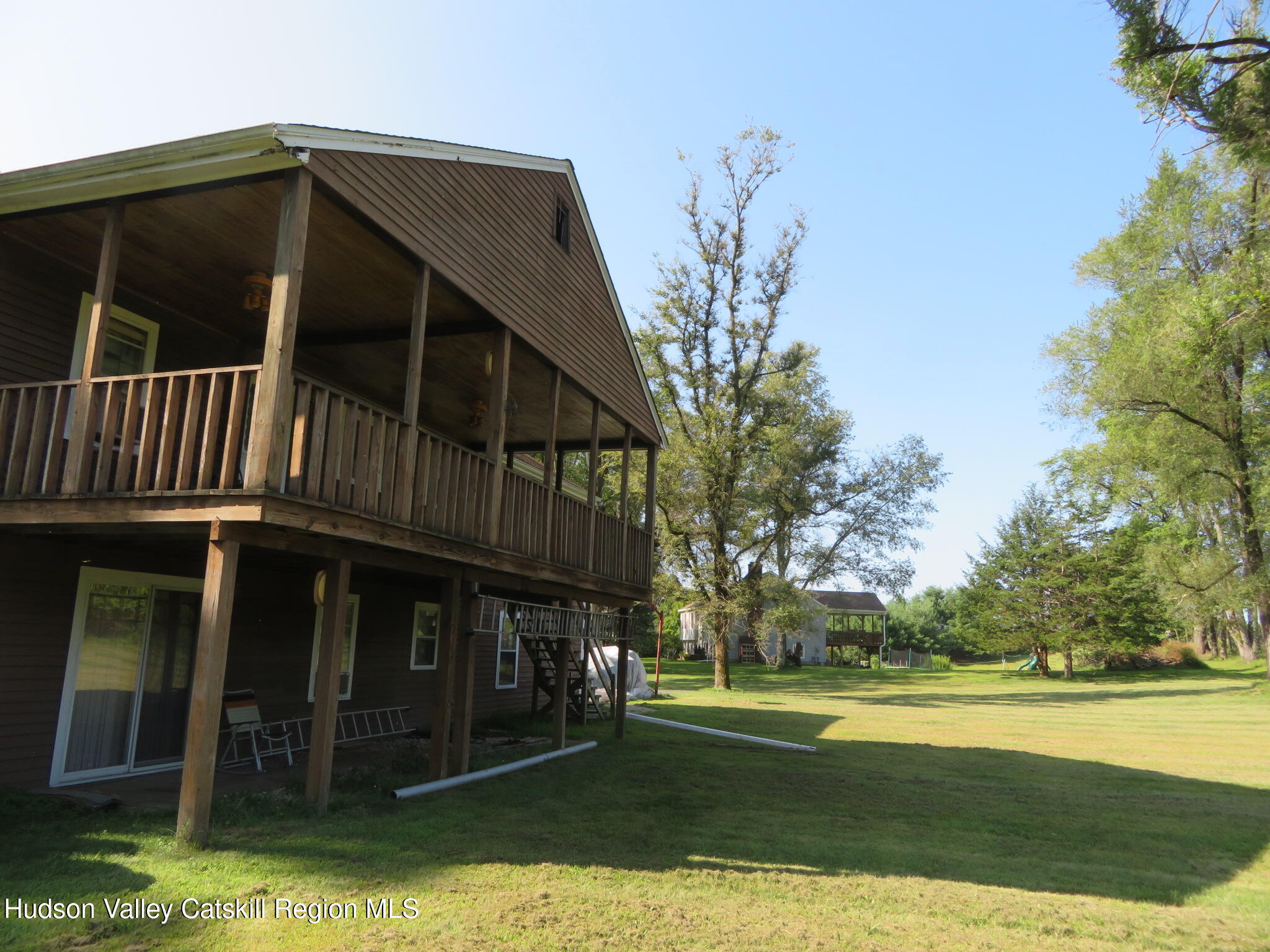 89 Vincent Lane Stone Ridge, NY 12484 - Photo 40 of 45 a view of a house with a yard