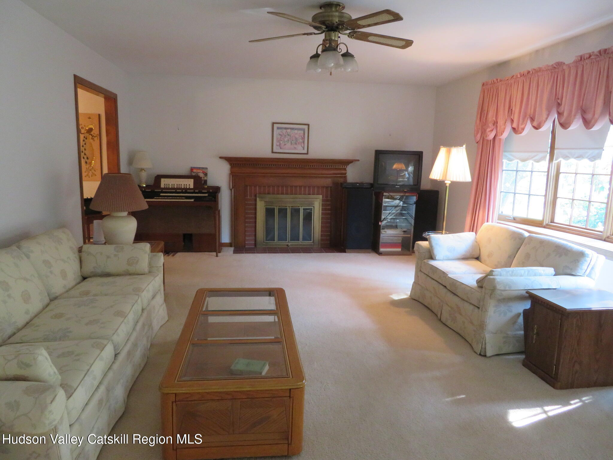 89 Vincent Lane Stone Ridge, NY 12484 - Photo 4 of 45 a living room with furniture and a fireplace