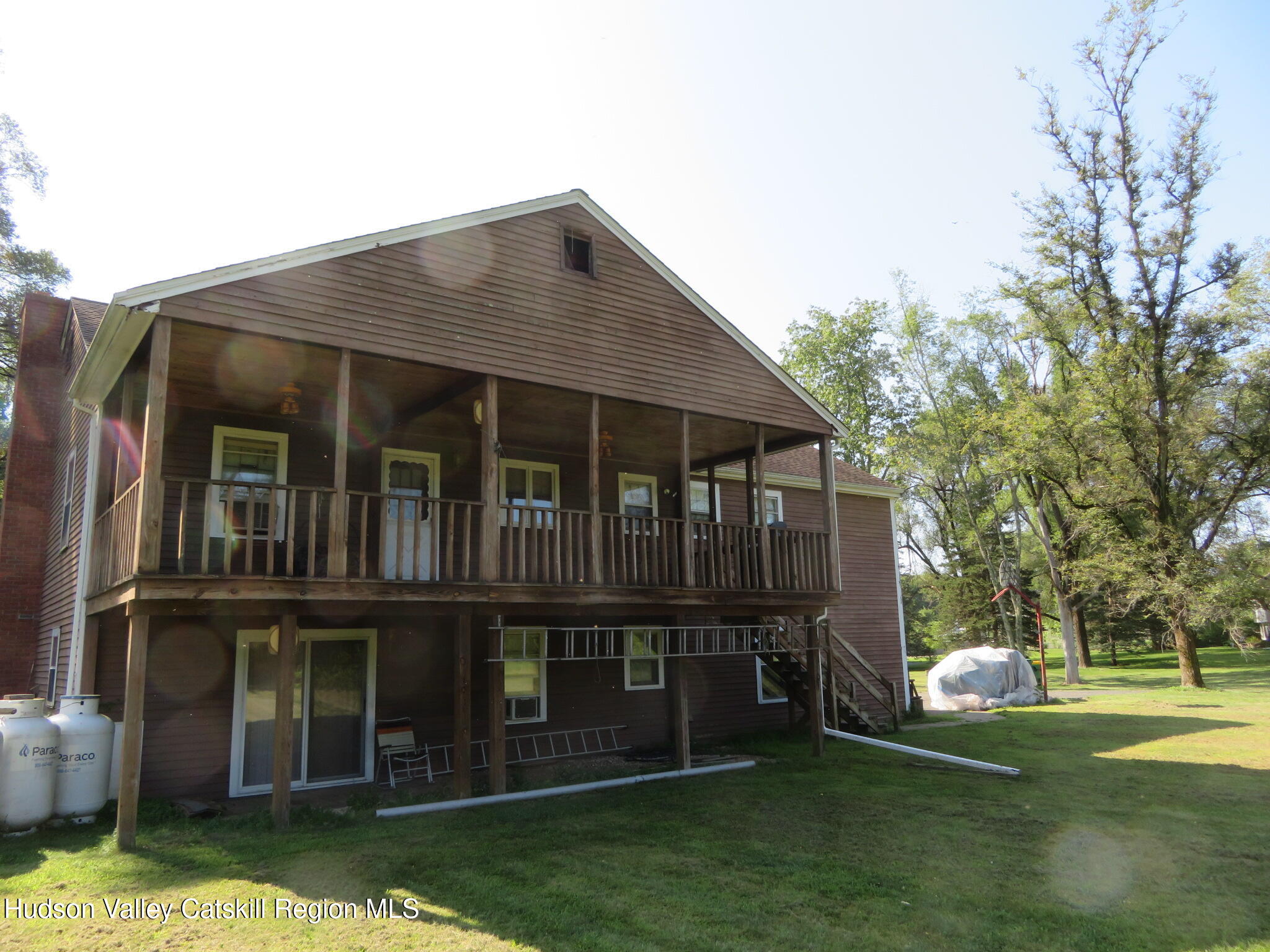 89 Vincent Lane Stone Ridge, NY 12484 - Photo 41 of 45 a front view of a house with a garden