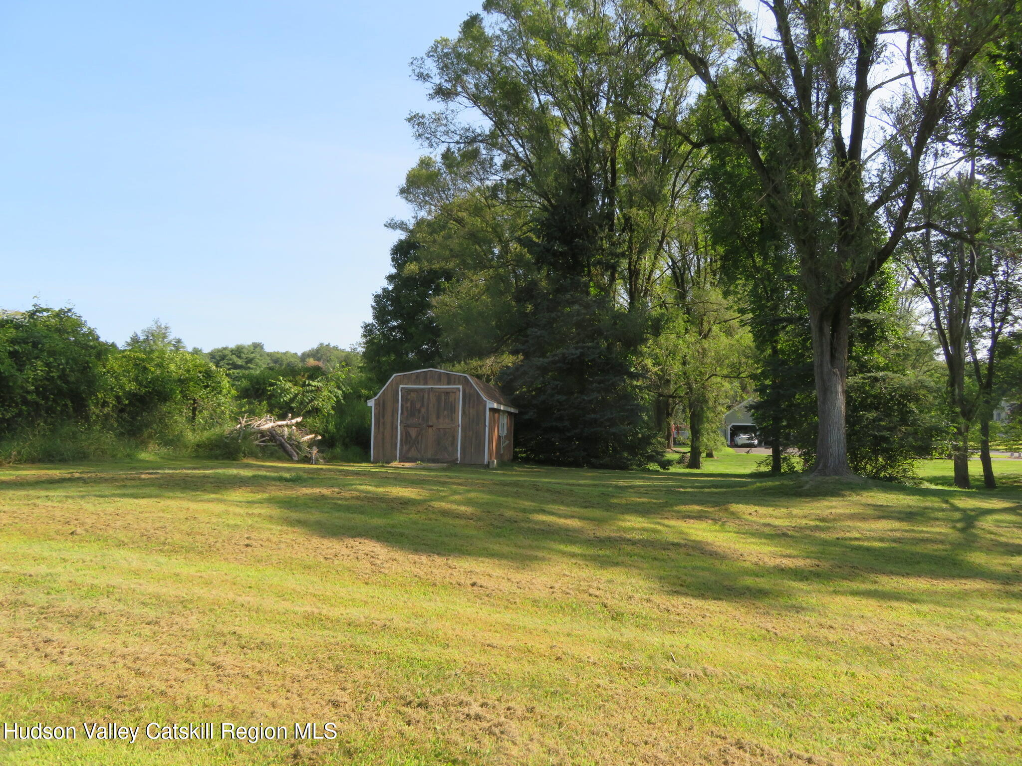 89 Vincent Lane Stone Ridge, NY 12484 - Photo 45 of 45 a view of a swimming pool with a big yard and large trees