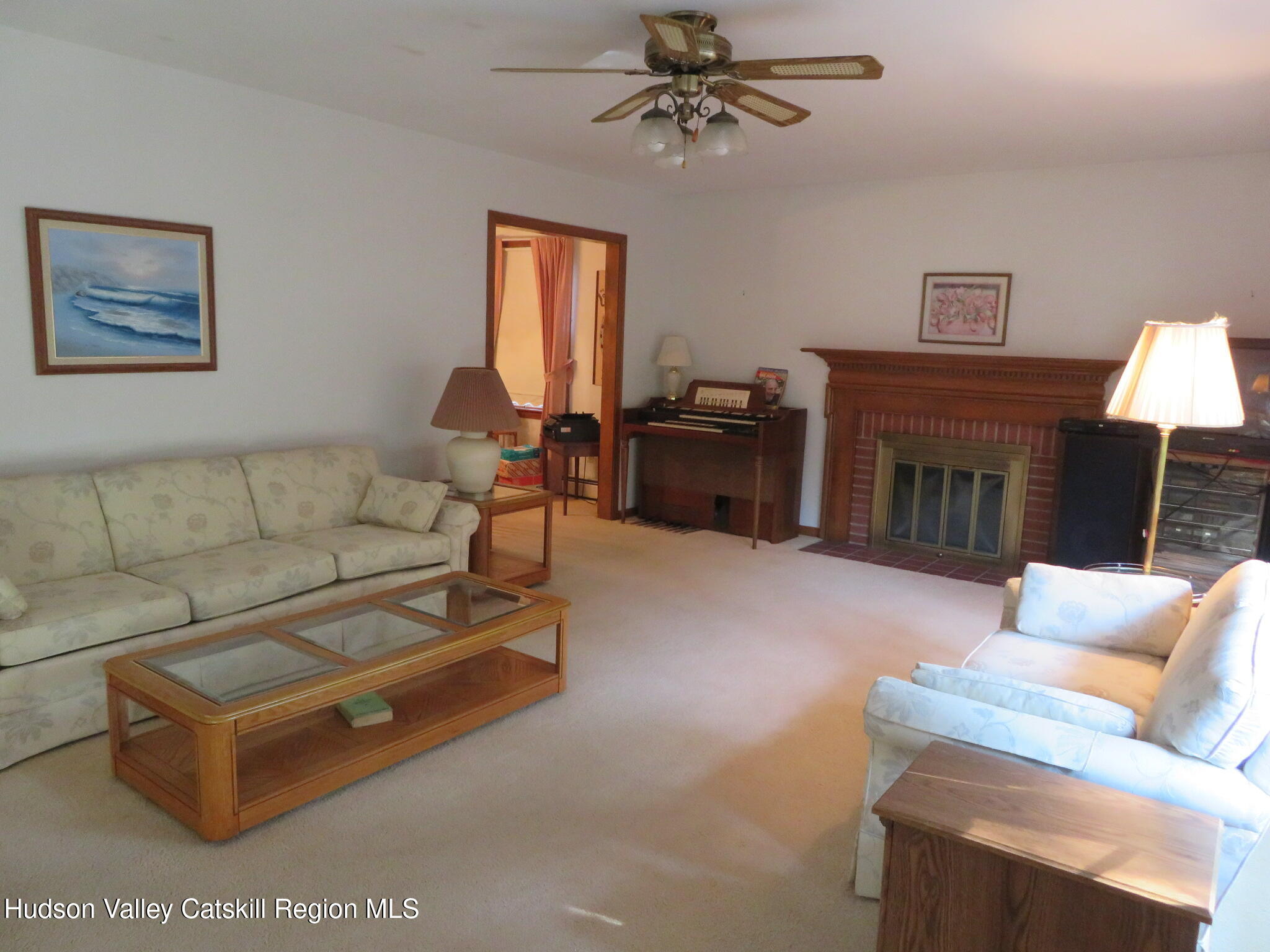 89 Vincent Lane Stone Ridge, NY 12484 - Photo 5 of 45 a living room with furniture and a fireplace