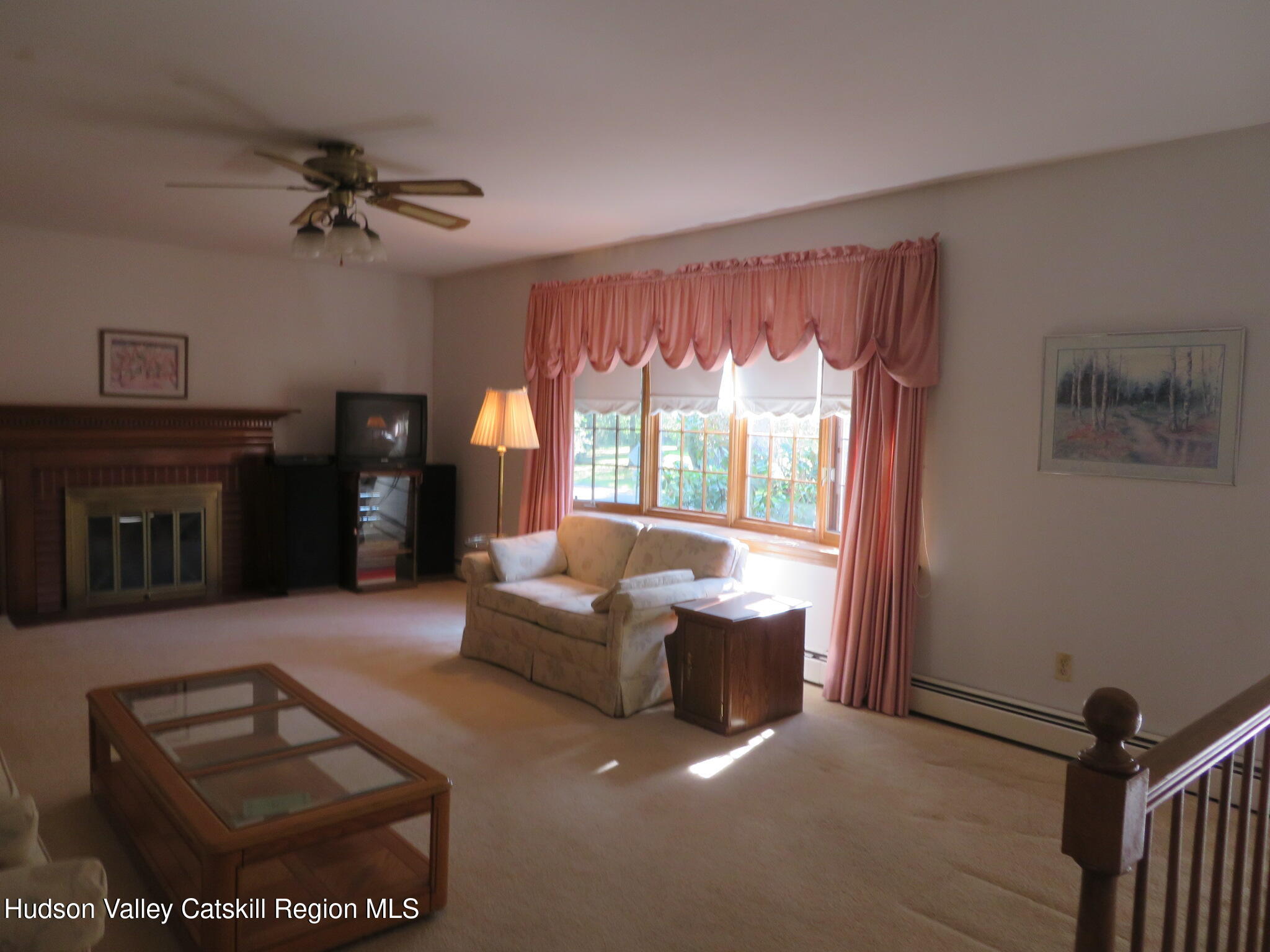 89 Vincent Lane Stone Ridge, NY 12484 - Photo 6 of 45 a living room with furniture and a fireplace