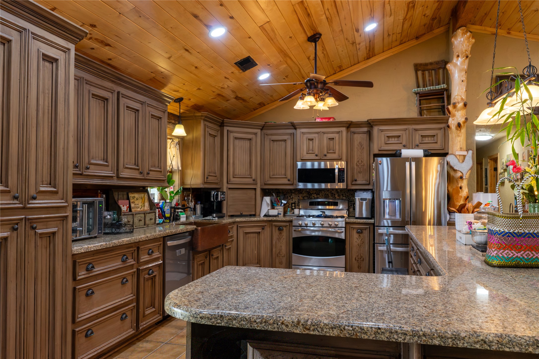 23888 Laneview Road Hempstead, TX 77445 - Photo 8 of 39 a kitchen with stainless steel appliances granite countertop a sink a stove and a refrigerator