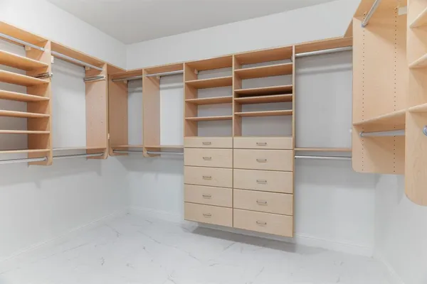 a view of an empty walk in closet