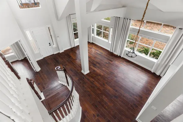 a view of an entryway with wooden floor