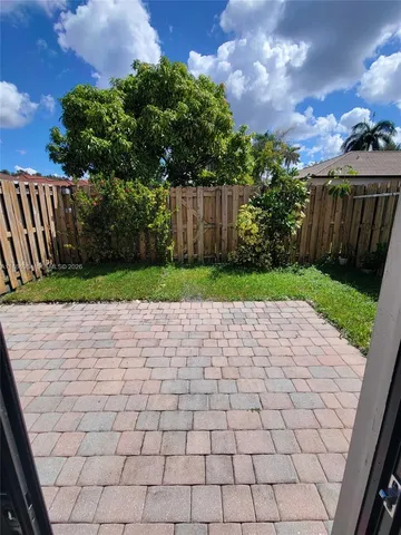a view of a backyard with green space