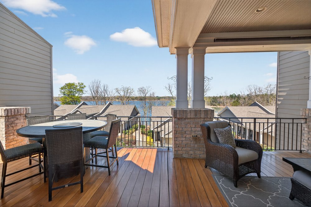 132 Regatta Drive Anderson, SC 29625 - Photo 13 of 50 This inviting porch offers tranquil views of the lake, perfect for relaxation.