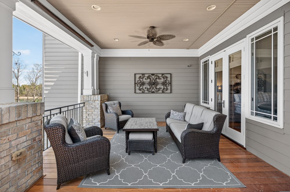 132 Regatta Drive Anderson, SC 29625 - Photo 15 of 50 Relax on this inviting covered porch with a refreshing outdoor ceiling fan.