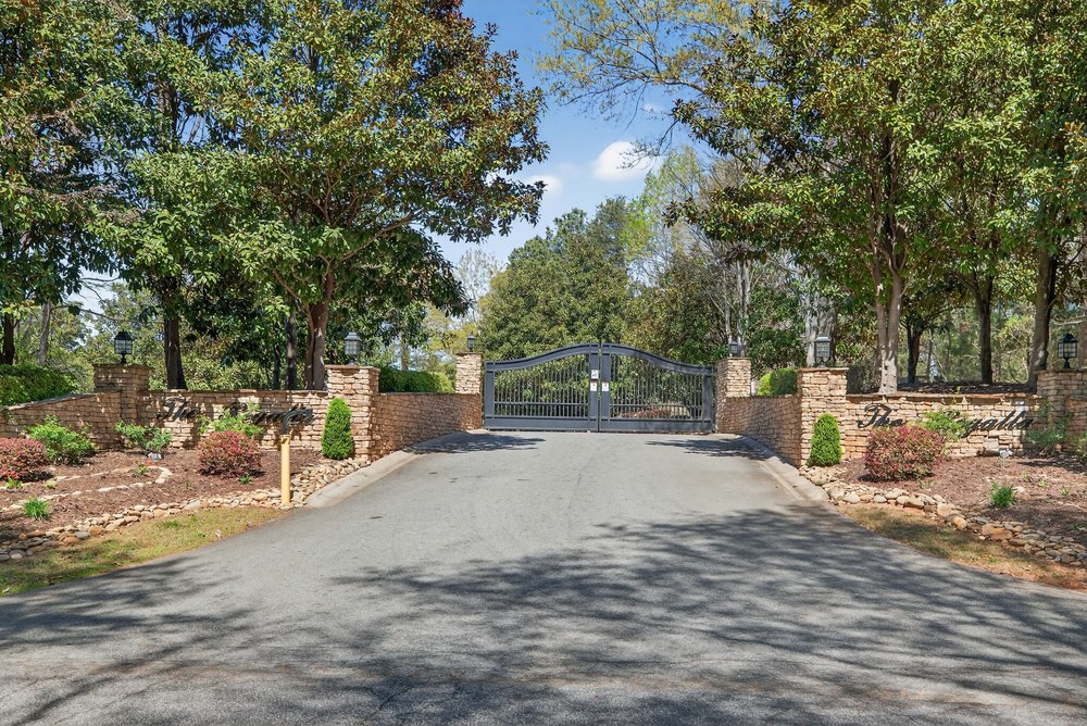 132 Regatta Drive Anderson, SC 29625 - Photo 2 of 50 Secure gated entry welcomes you to this distinguished property, offering privacy and curb appeal.