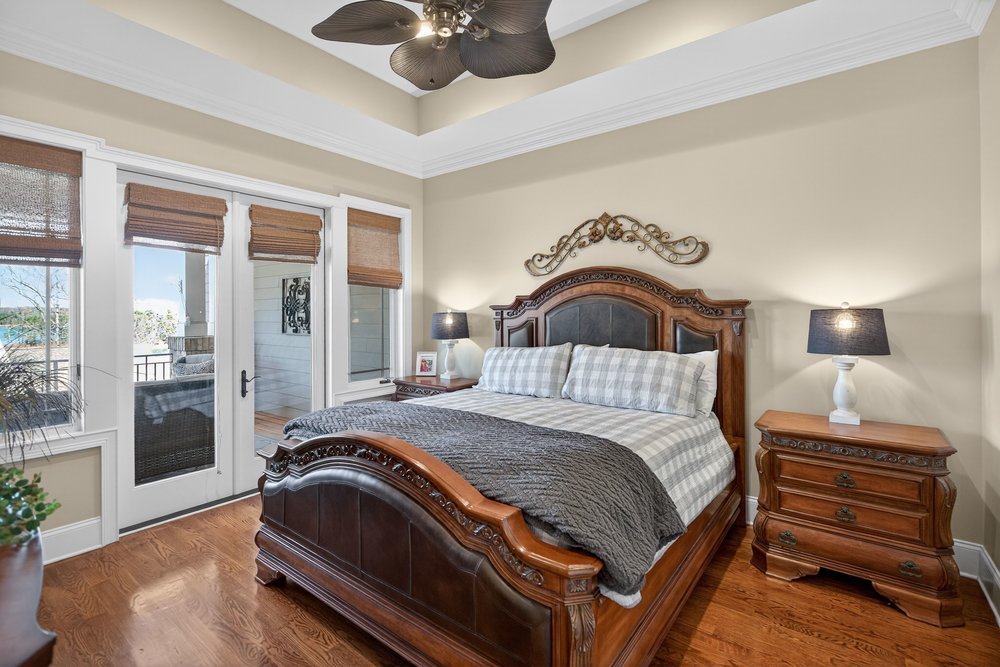 132 Regatta Drive Anderson, SC 29625 - Photo 25 of 50 This spacious master bedroom offers serene views and comfortable living with direct outdoor access.