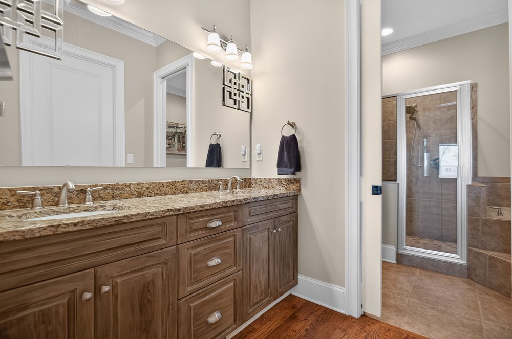 132 Regatta Drive Anderson, SC 29625 - Photo 27 of 50 This bathroom features dual vanities and a tiled shower for comfort and convenience.