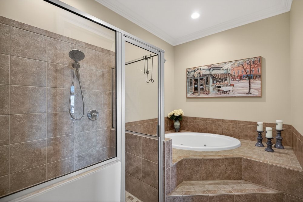 132 Regatta Drive Anderson, SC 29625 - Photo 28 of 50 Relax in this tranquil space featuring a tiled shower and an inviting soaking tub.