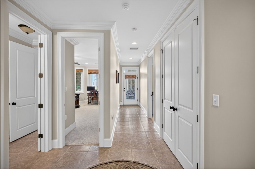 132 Regatta Drive Anderson, SC 29625 - Photo 30 of 50 This spacious hallway features elegant crown molding and leads to storage, two lower level bedroom and two full bathrooms and lower level porch.