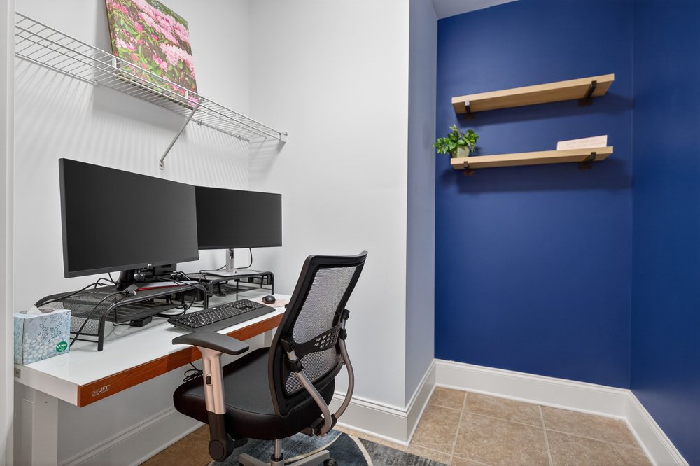 132 Regatta Drive Anderson, SC 29625 - Photo 35 of 50 This is a large closet that is being used as another office space with built-in shelving, perfect for productivity and organization.