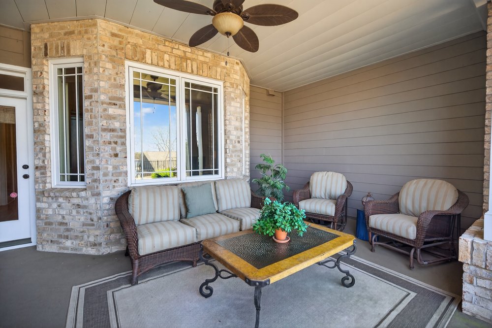 132 Regatta Drive Anderson, SC 29625 - Photo 38 of 50 This inviting lower level porch, featuring a classic brick exterior and durable flooring and water proof ceiling to keep your furniture dry when it is raining.