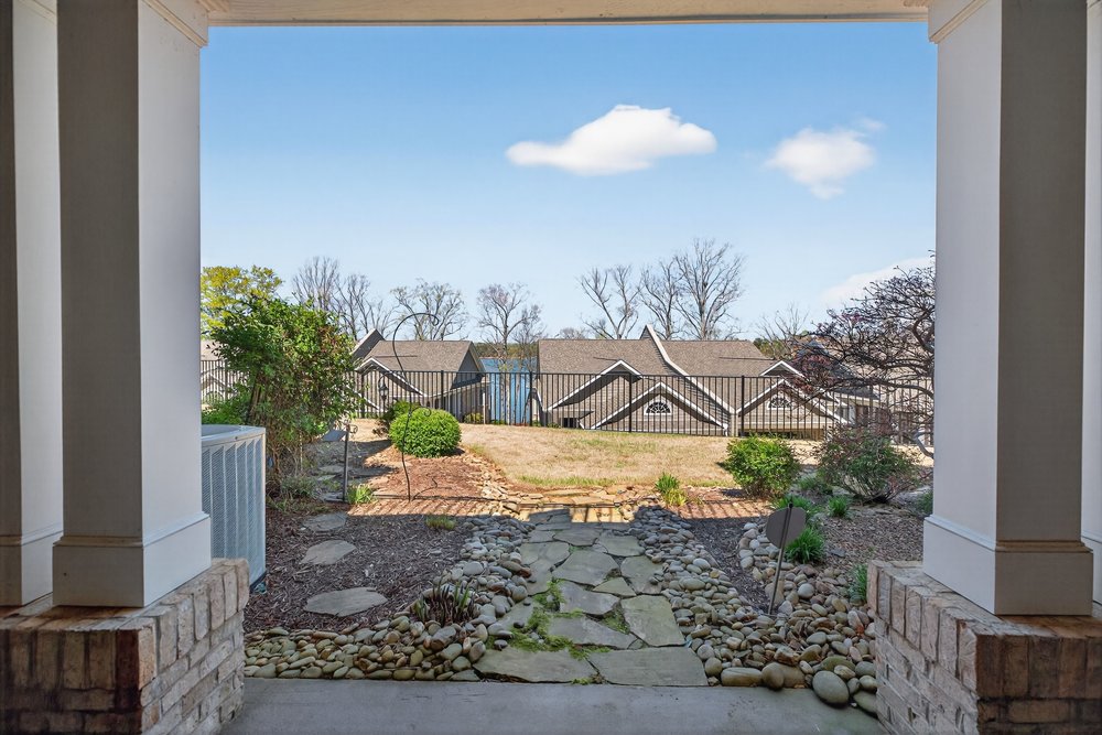 132 Regatta Drive Anderson, SC 29625 - Photo 39 of 50 View the serene landscape and neighborhood beyond from this inviting outdoor space.