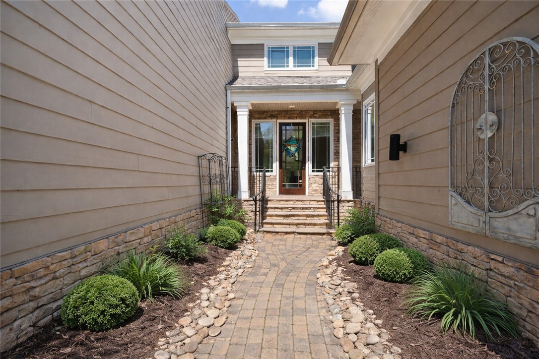132 Regatta Drive Anderson, SC 29625 - Photo 4 of 50 This inviting entrance features a stone pathway leading to a flag stone front porch and welcoming front door.