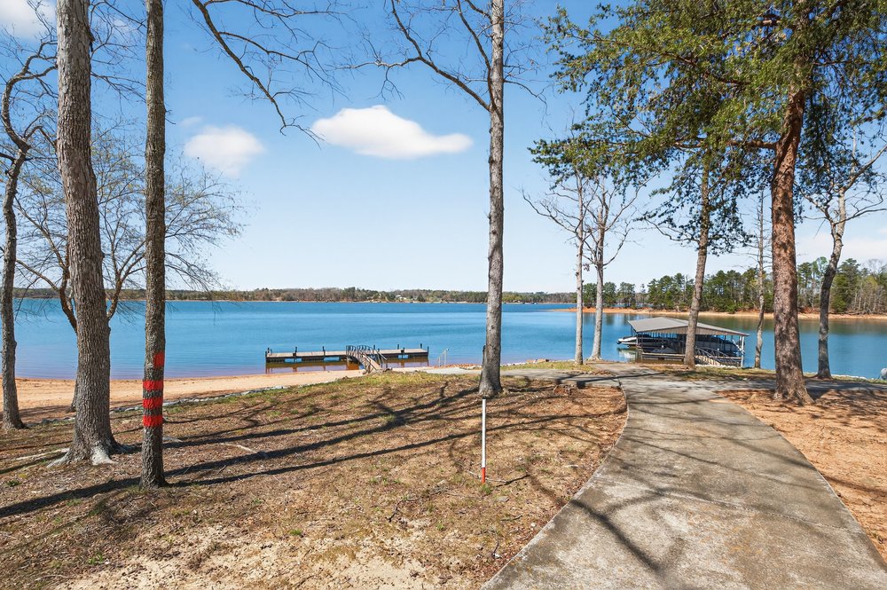 132 Regatta Drive Anderson, SC 29625 - Photo 42 of 50 This serene lakeside property offers direct access to the water, complete with a private dock.