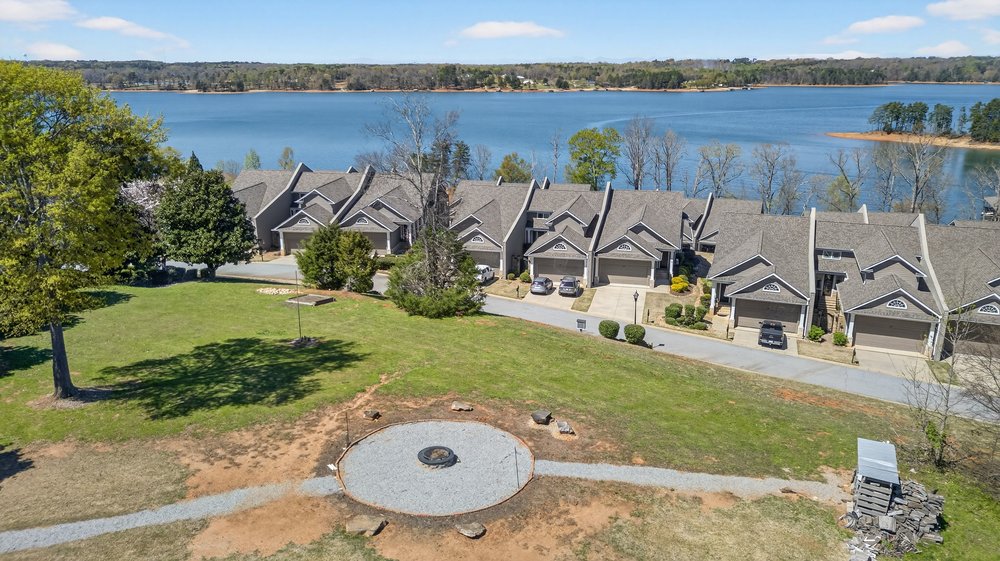 132 Regatta Drive Anderson, SC 29625 - Photo 46 of 50 Part ownership of this large outdoor area with a large fire pit sourounded by beautiful trees and a gorgeous view of Lake Hartwell, perfect for large gatherings. Each owner of this upper area pay 200.00 dollars per year to use and maintain.
