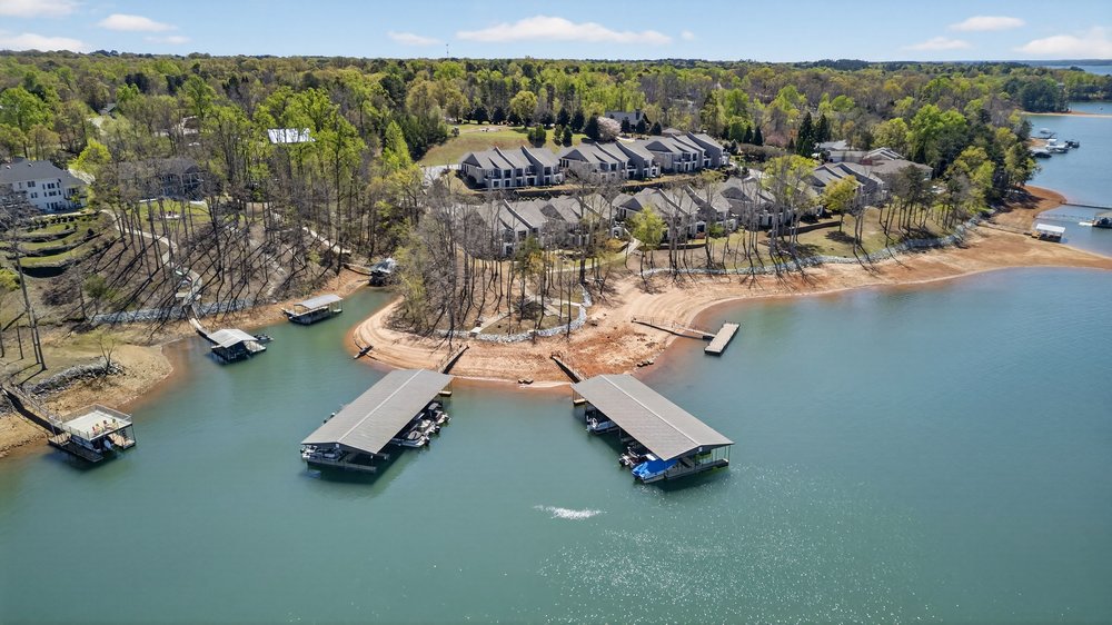 132 Regatta Drive Anderson, SC 29625 - Photo 48 of 50 This aerial view showcases a picturesque waterfront community with private docks and scenic surroundings.