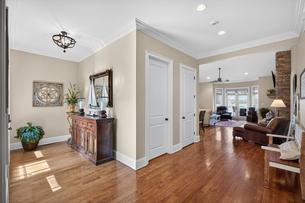 132 Regatta Drive Anderson, SC 29625 - Photo 7 of 50 This inviting entryway showcases a blend of rich wood and bright architectural details, leading to an open living area.