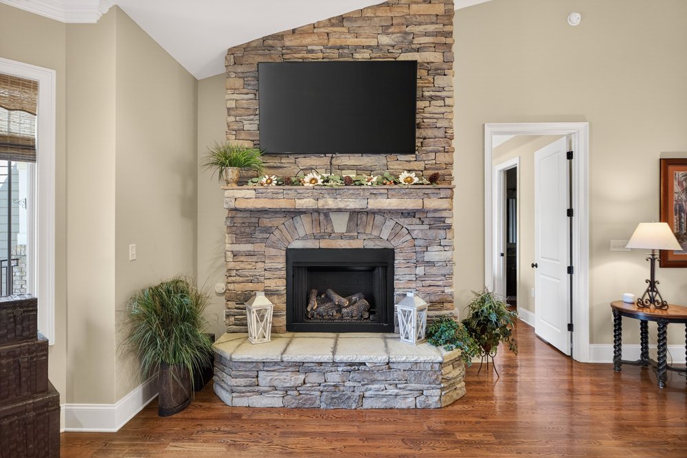 132 Regatta Drive Anderson, SC 29625 - Photo 10 of 50 This living room features a beautifully crafted stone fireplace, ideal for relaxation.