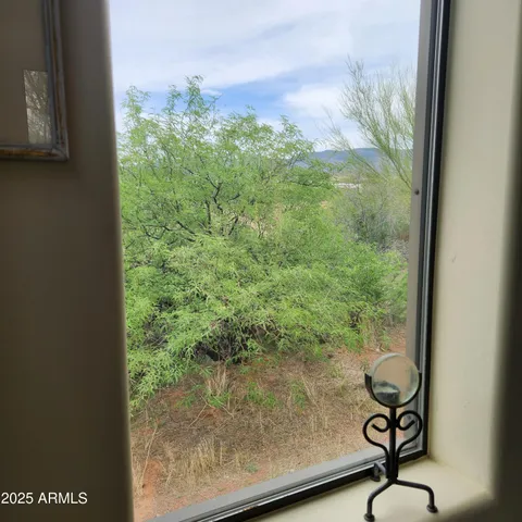 a view of balcony with wooden floor