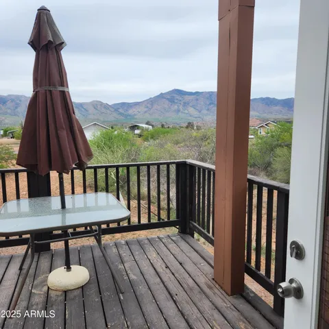 a view of balcony with furniture