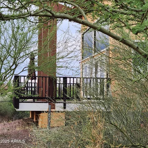a kitchen with stainless steel appliances granite countertop a sink a window and cabinets