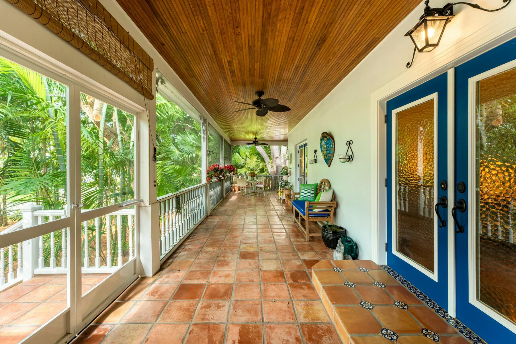 33 Pen Key Drive Islamorada, FL 33036 - Photo 2 of 60 a view of a porch with wooden floor and furniture