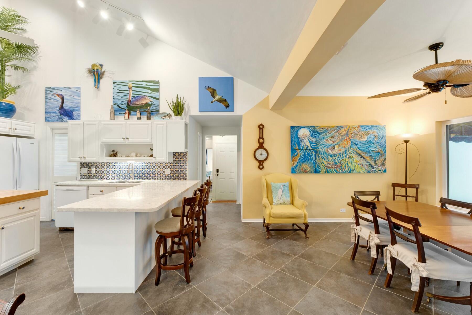 33 Pen Key Drive Islamorada, FL 33036 - Photo 21 of 60 a living room with stainless steel appliances kitchen island a table and chairs in it