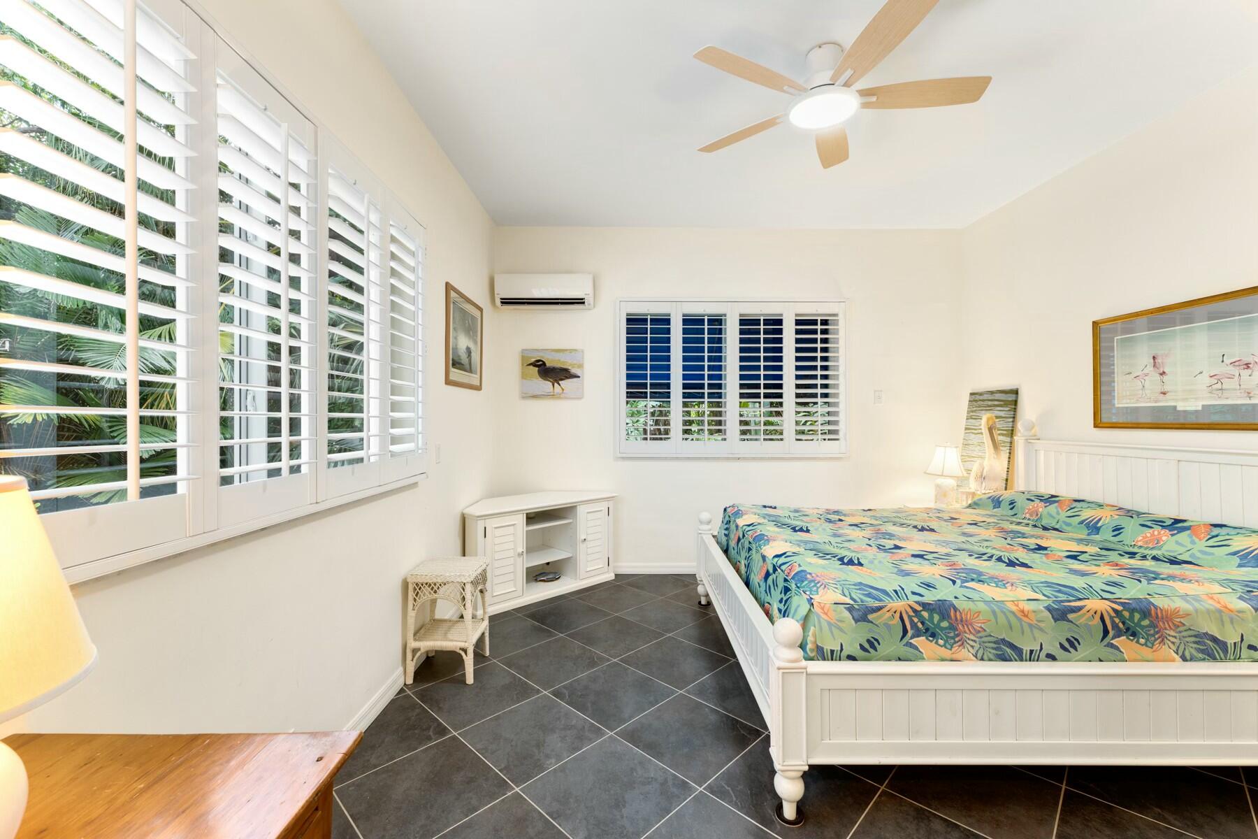 33 Pen Key Drive Islamorada, FL 33036 - Photo 27 of 60 a bedroom with a bed and a window