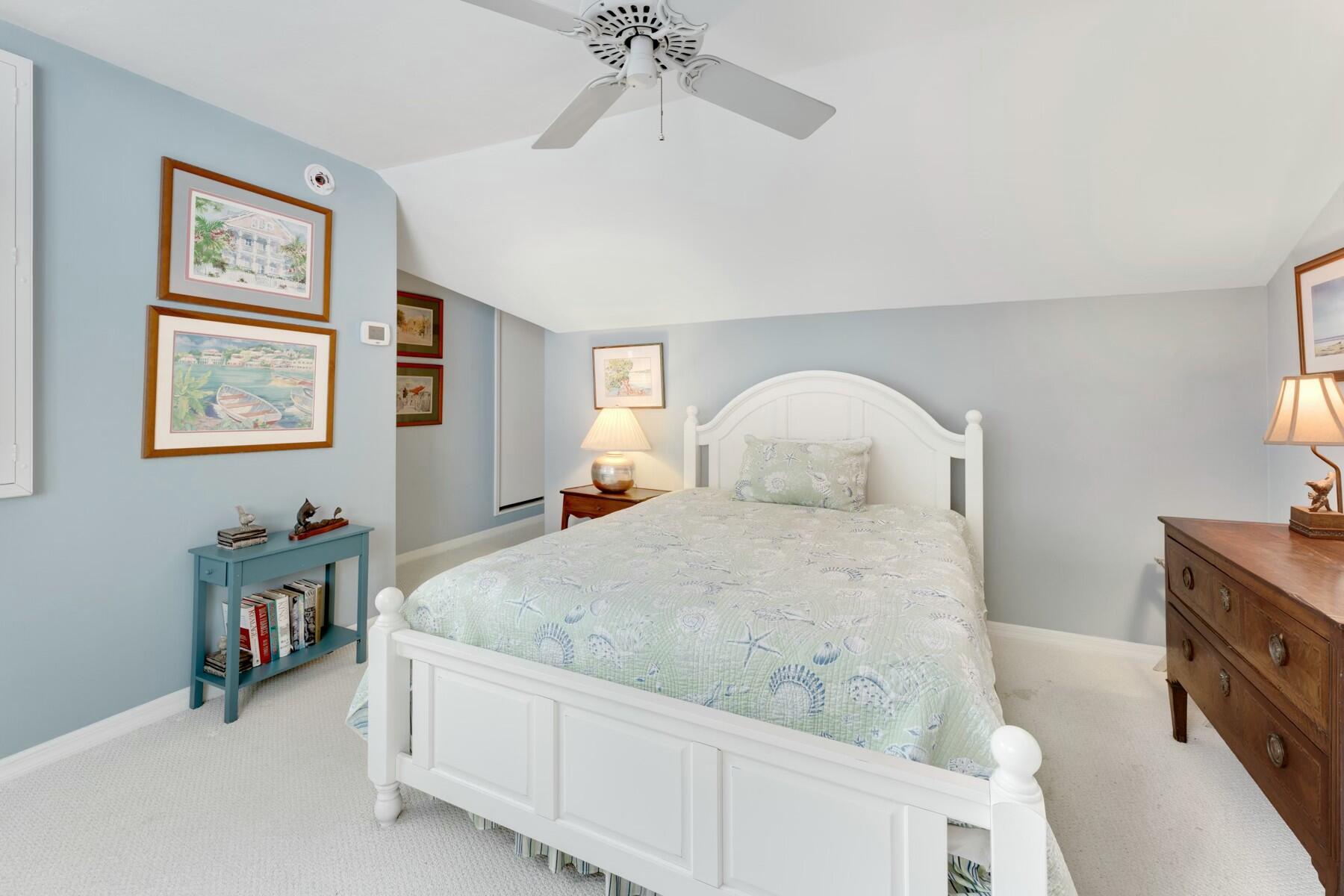 33 Pen Key Drive Islamorada, FL 33036 - Photo 43 of 60 a bedroom with a bed and a chandelier