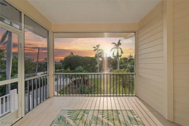 a view of a balcony with wooden floor