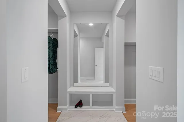 a view of entryway with stairs and wooden floor