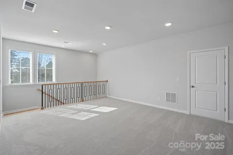 a bathroom with a sink toilet vanity and shower