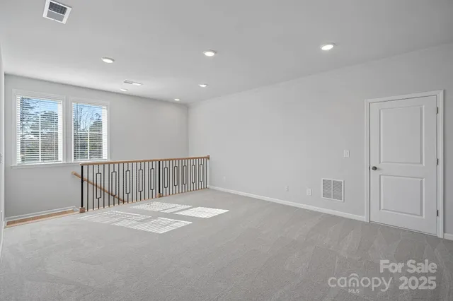 a bathroom with a sink toilet vanity and shower