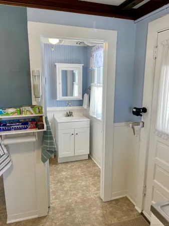 a utility room with cabinets washer and dryer