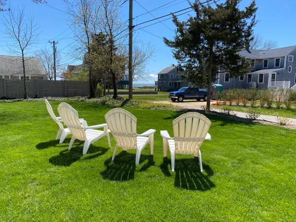 a view of a table and chairs in the garden