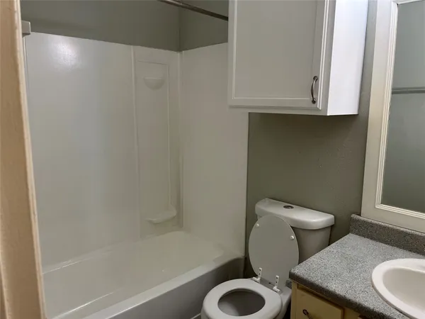 a bathroom with a sink vanity and mirror