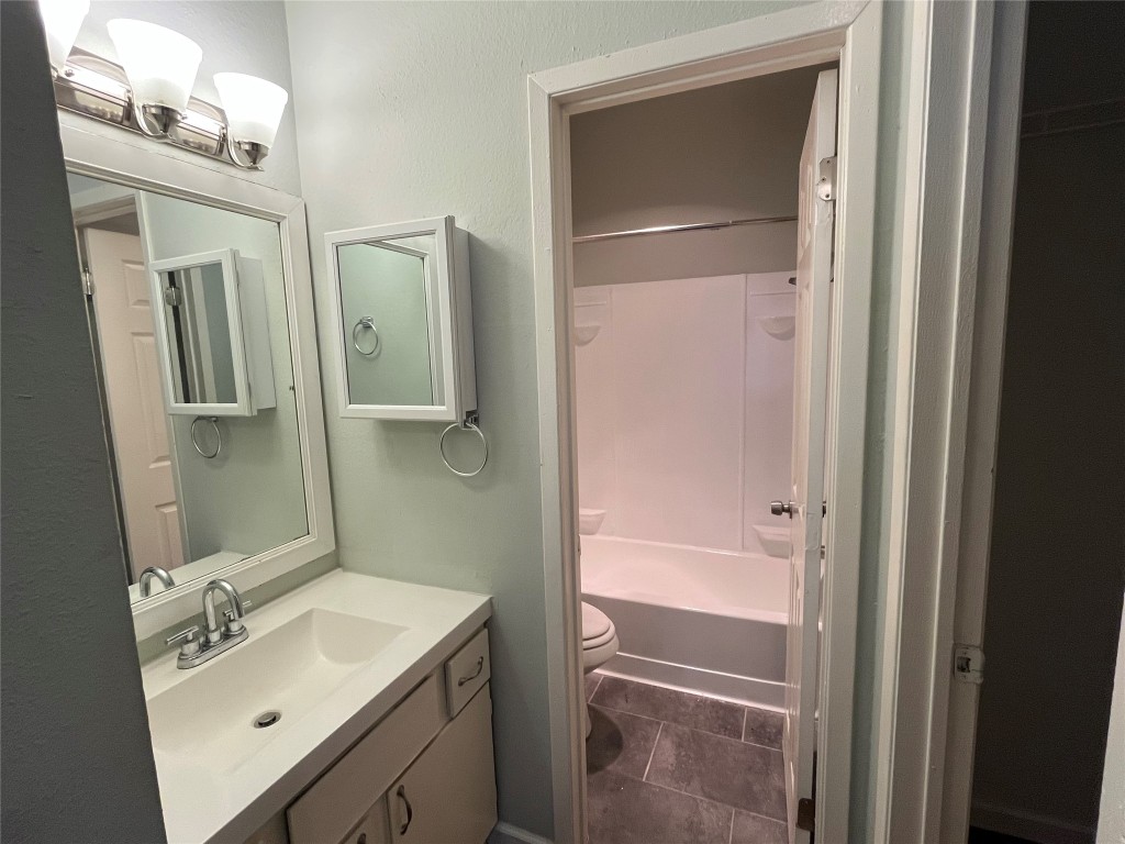 9502 Kempler Drive, Unit B Austin, TX 78748 - Photo 16 of 18 Full bathroom featuring vanity and shower / bath combination
