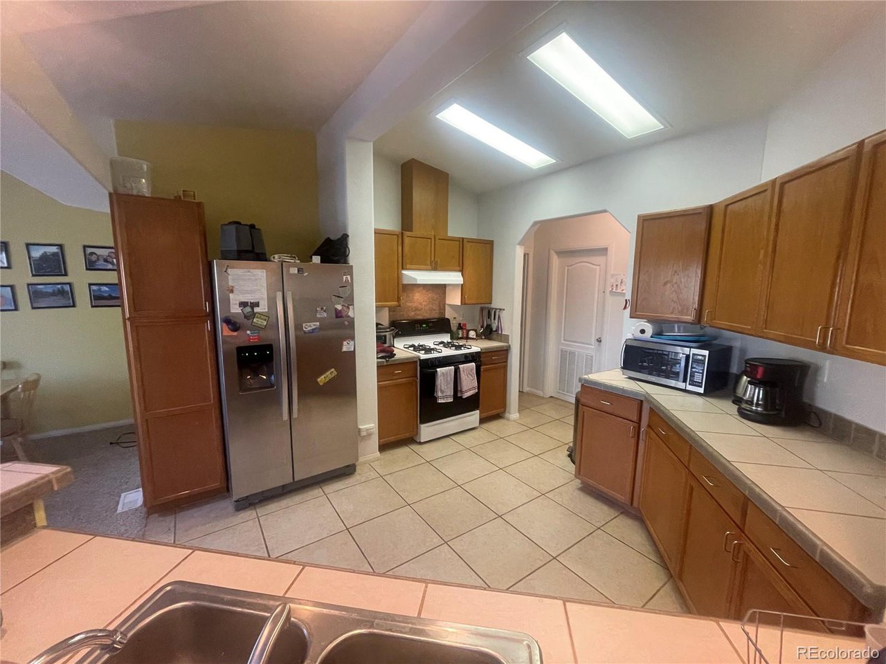 663 Bellows Road Hartsel, CO 80449 - Photo 14 of 32 a kitchen with stainless steel appliances granite countertop a refrigerator and a sink